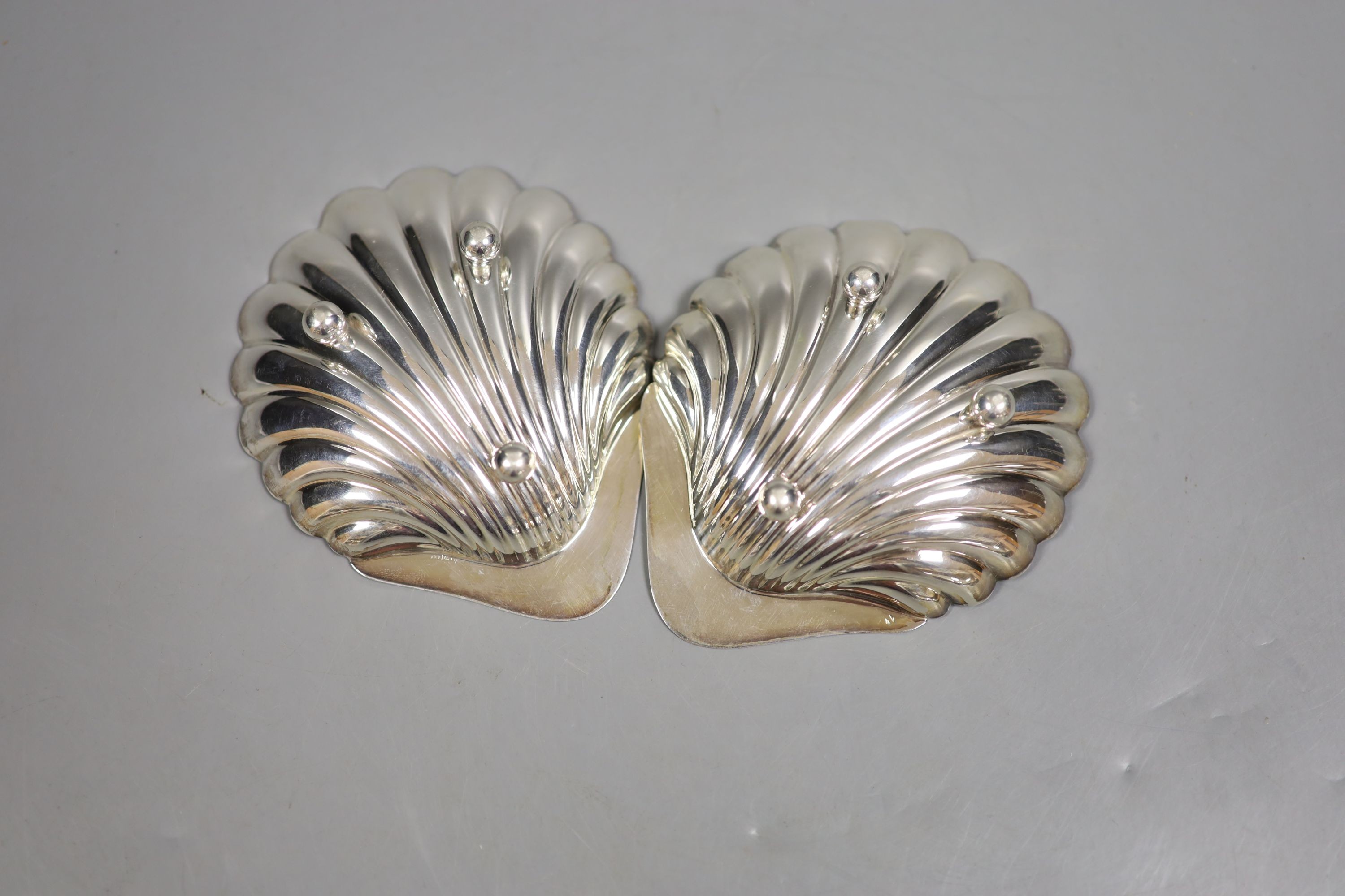 A pair of George V silver butter shells, Atkin Bros. Sheffield, 1920, 12cm, 111 grams.